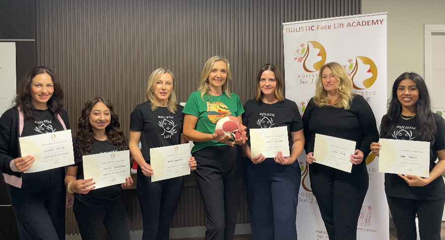Students holding certificates after training