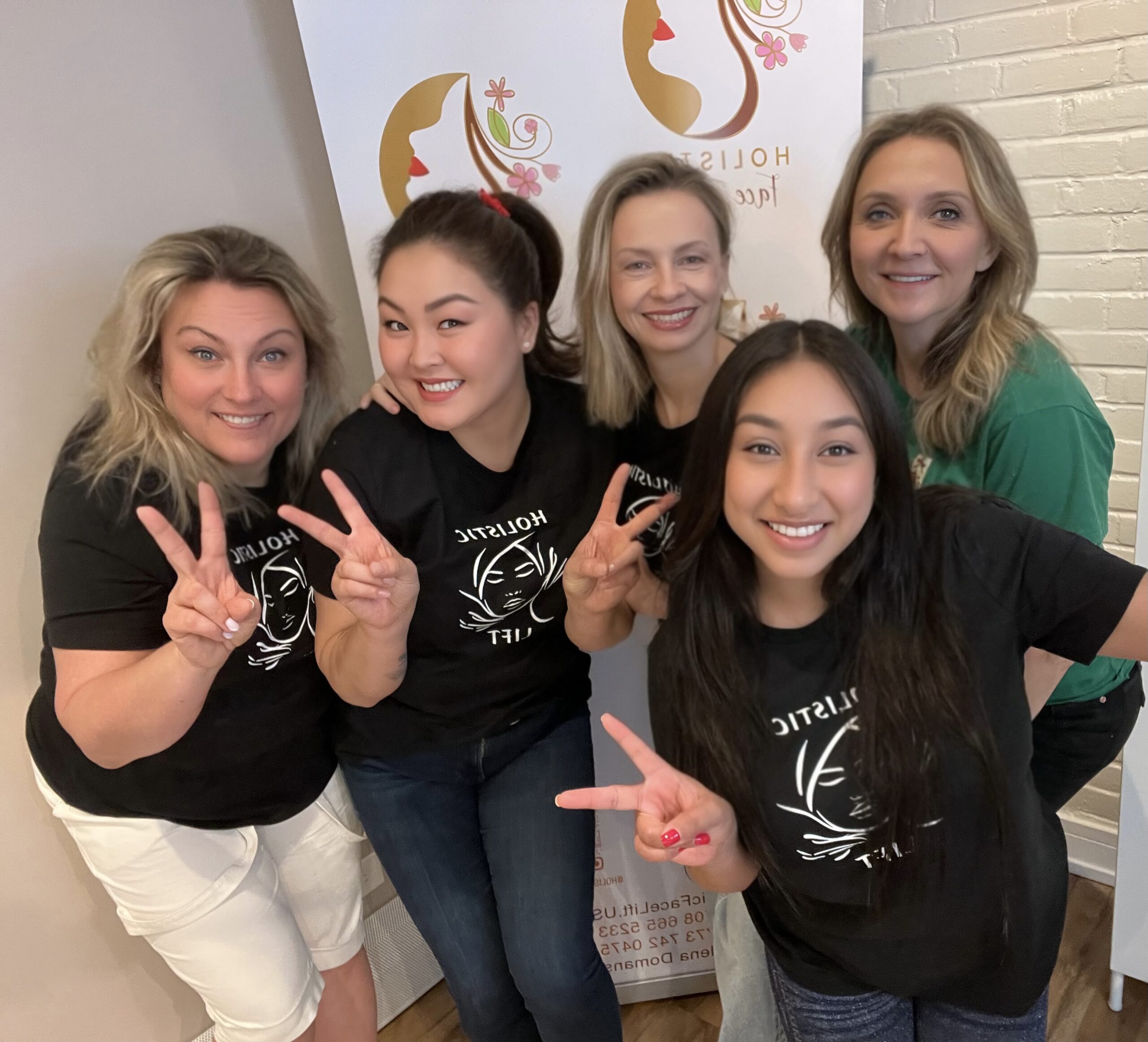 Students holding certificates after Korugi training